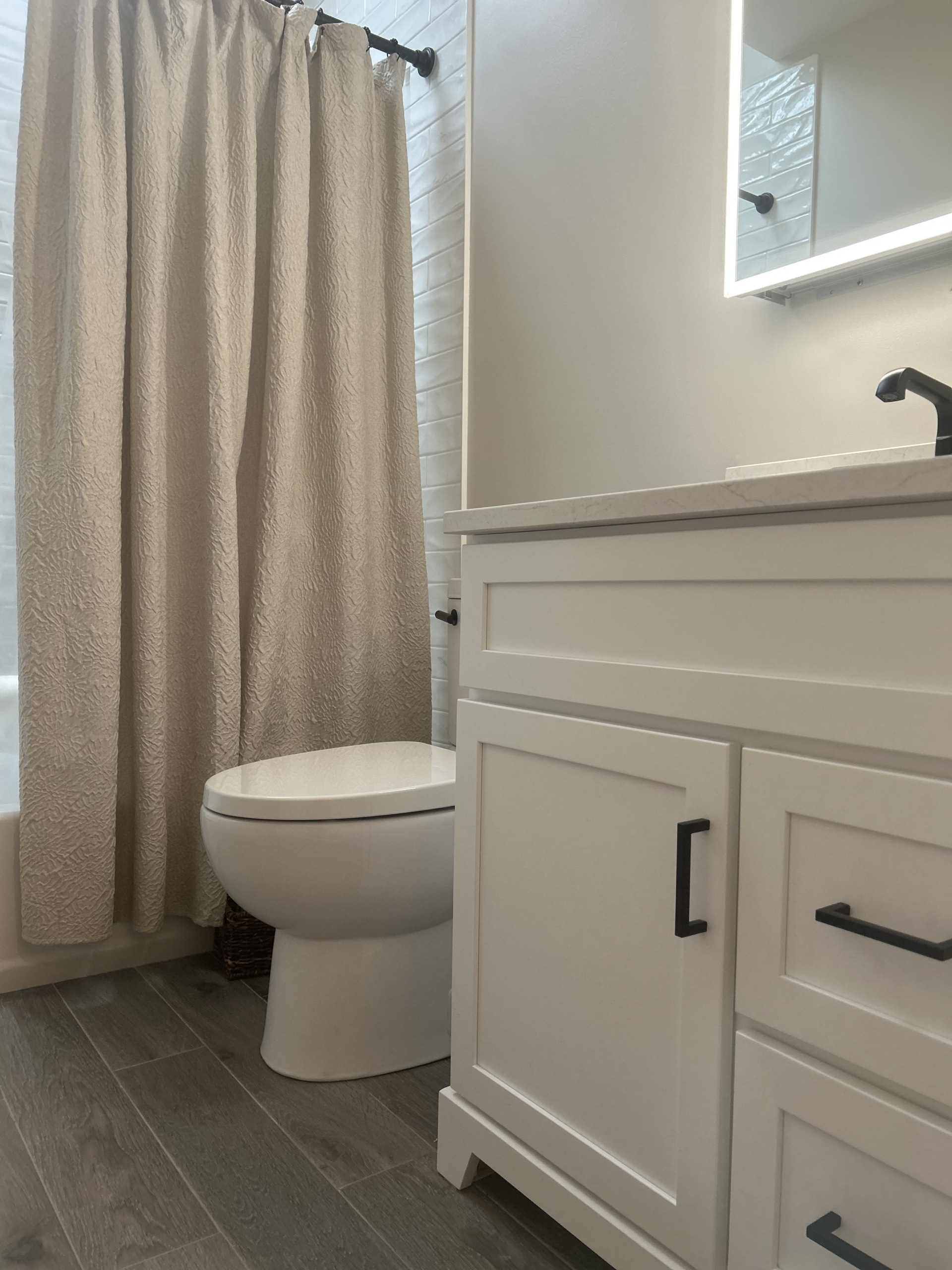 A renovated bathroom in New Jersey in neutral tones. Contractors - Loughlin & Son Construction