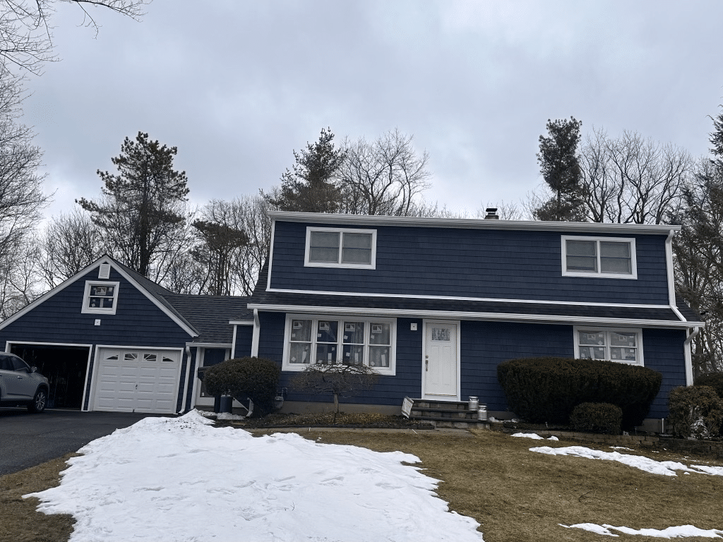 Blue House with New Siding in Rockland County Installed by Loughlin & Son Construction