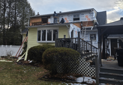 Loughlin & Son Construction Installing Siding on a Home in Rockland County NY